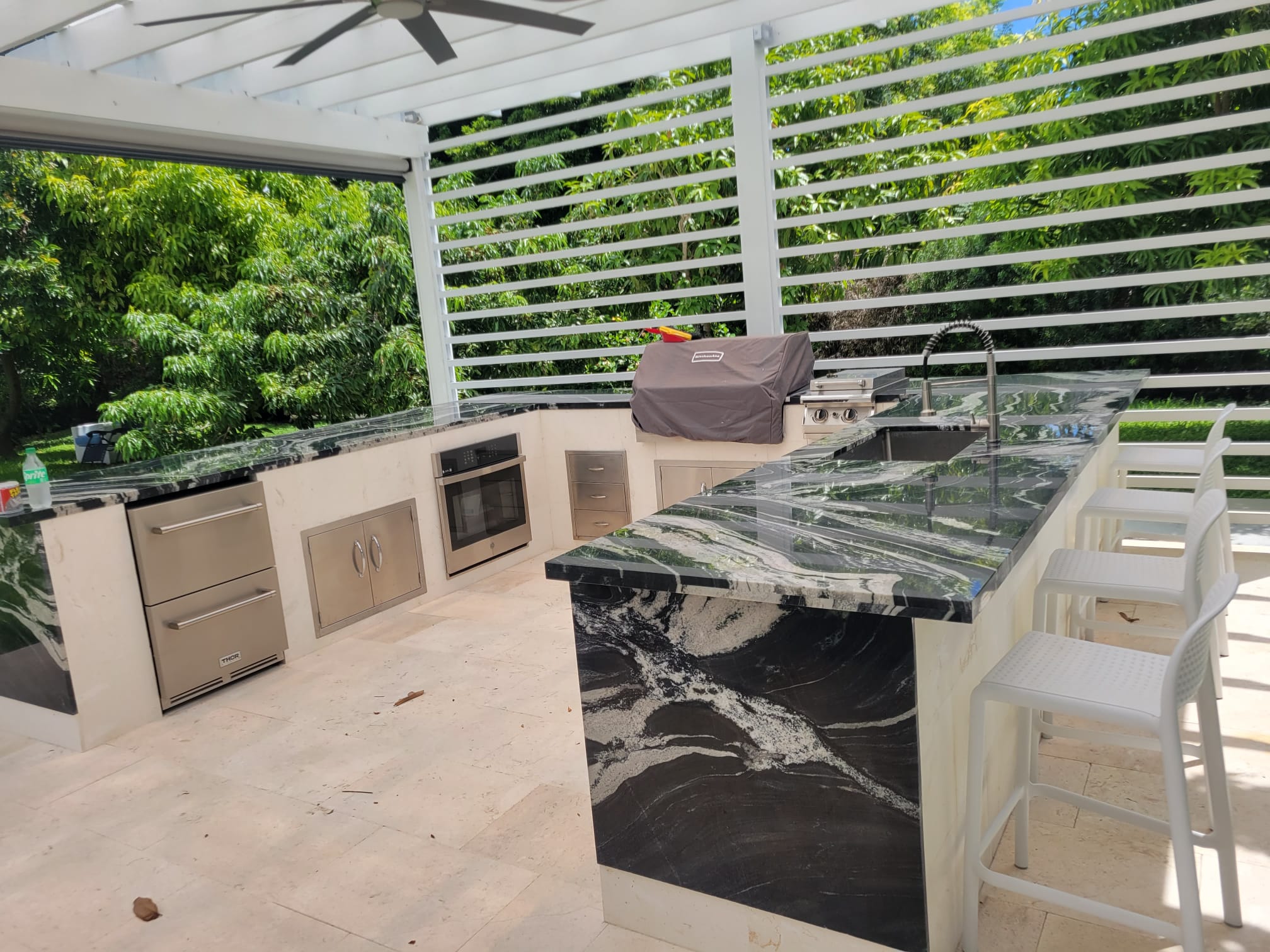 Natural stone patio, coping, or pool deck by Bravex Trade Services.
