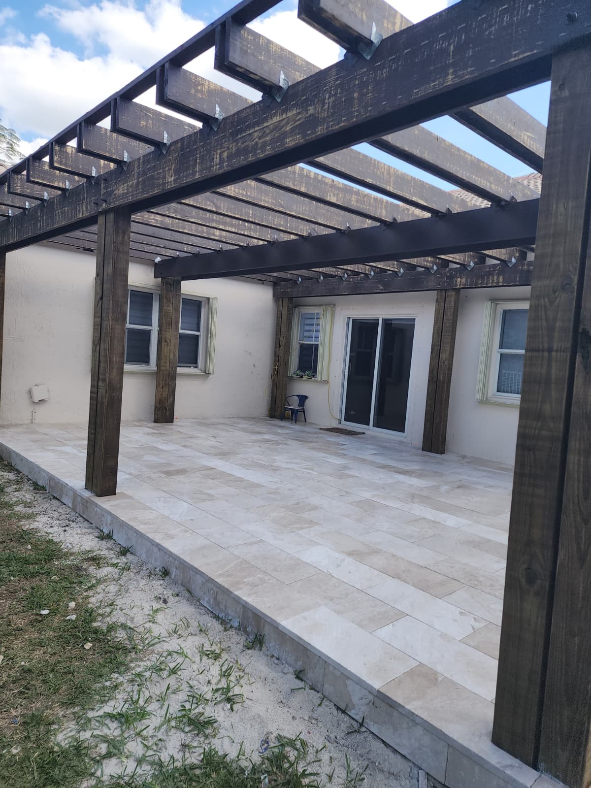 Covered patio, lighting, or evening outdoor living space.